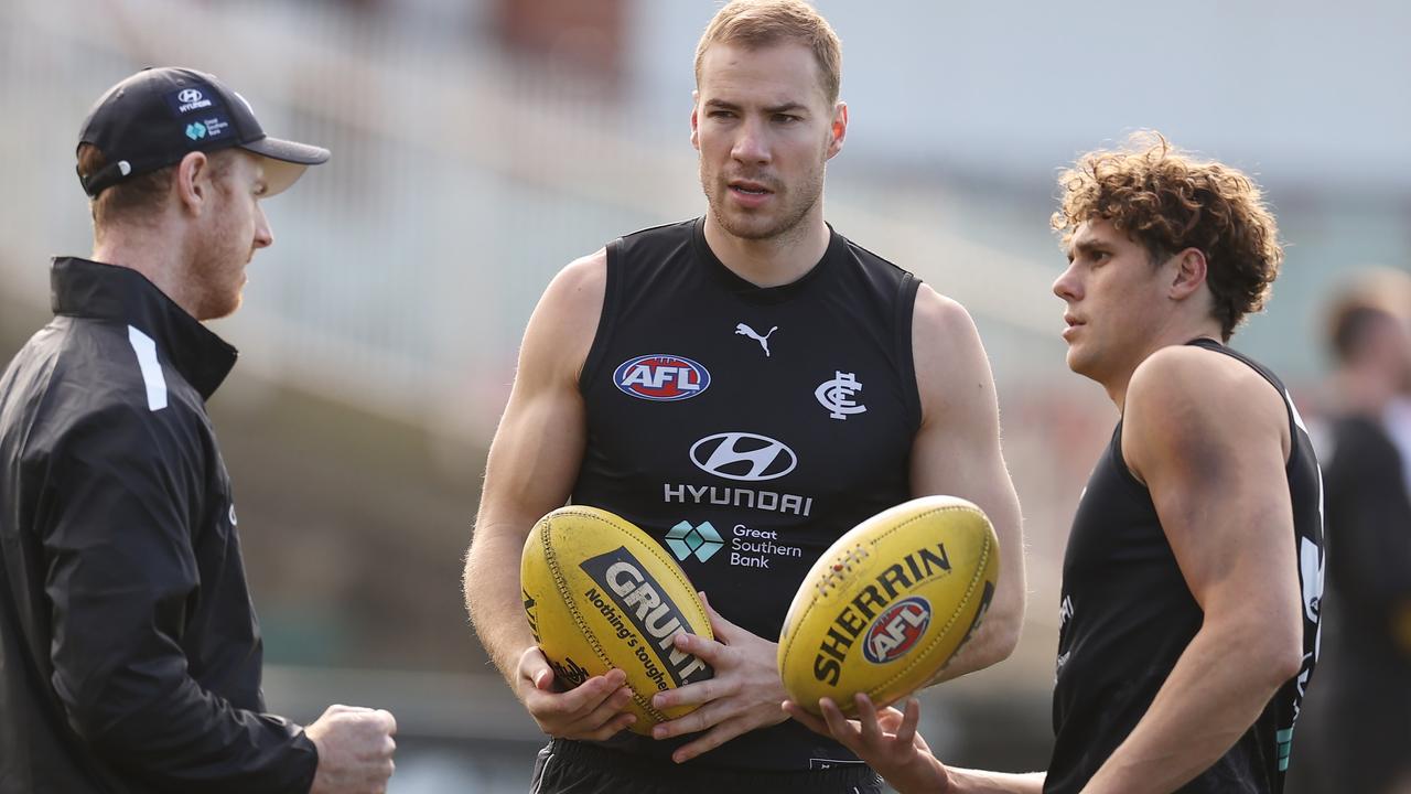 Carlton’s Harry McKay and Charlie Curnow talk with forward line coach Ash Hansen. Picture: Michael Klein