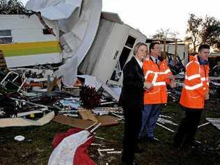 NSW Premier Kristina Keneally inspects tornado damage yesterday morning at the Lake Ainsworth Caravan Park with NSW SES Commissioner Murray Kear (centre) and NSW Emergency Services Minister Steve Whan. . Picture: Jay Cronan