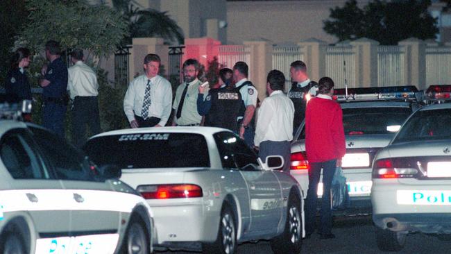 Police at the home of former KGB colonel Gennadi Bernovski after he was shot dead while putting out bins.