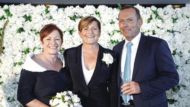 Christine Forster, centre, pictured at her wedding with partner Virginia Edwards and brother Tony Abbott. Picture: Inlighten Photography