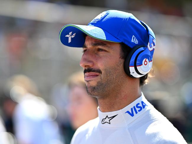 BAKU, AZERBAIJAN - SEPTEMBER 15: Daniel Ricciardo of Australia and Visa Cash App RB looks on on the grid prior to the F1 Grand Prix of Azerbaijan at Baku City Circuit on September 15, 2024 in Baku, Azerbaijan. (Photo by Dan Mullan/Getty Images)