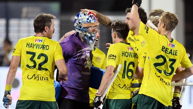 Teammates mob goalkeeper Andrew Charter after he saved the Spanish penalty stroke. (Photo by WorldSportPics/Frank Uijlenbroek)