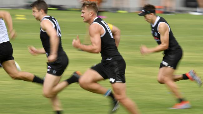 Ollie Wines hits the track during Port Adelaide’s pre-season. Picture: Kelly Barnes.