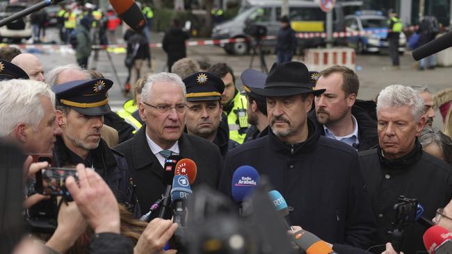 Bavarian interior minister Joachim Herrmann comments to reporters next to state premier Markus Soeder and Munich Lord Mayor Dieter Reiter (right). Picture: Johannes Simon / Getty