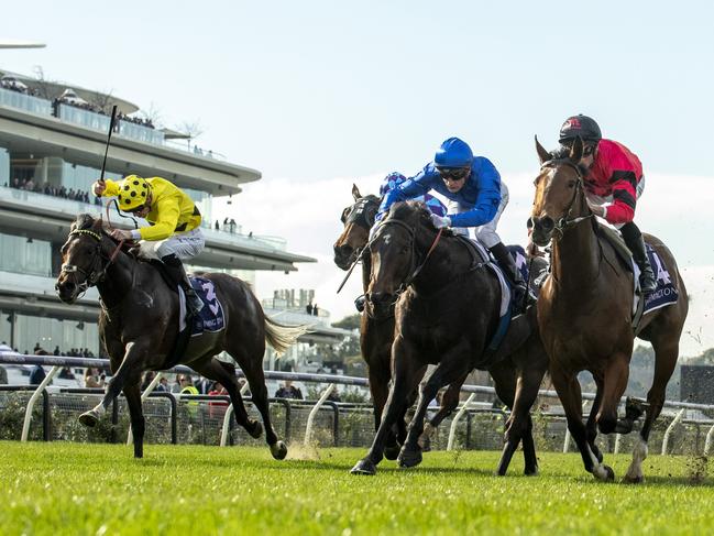 MELBOURNE, AUSTRALIA - JUNE 22: Daniel Stackhouse riding Sneaky Sunrise (r) defeats Blake Shinn riding Pisces in race 1, the Ken Cox Handicap - Betting Odds during Melbourne Racing at Flemington Racecourse on June 22, 2024 in Melbourne, Australia. (Photo by Vince Caligiuri/Getty Images)