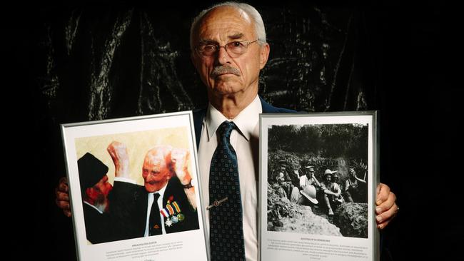 Images and a message ... Aytuner Akbas with some of the images which will go on display in a centenary exhibition at Ramsgate RSL Club leading up to ANZAC DAY. Picture: Jonathan Ng