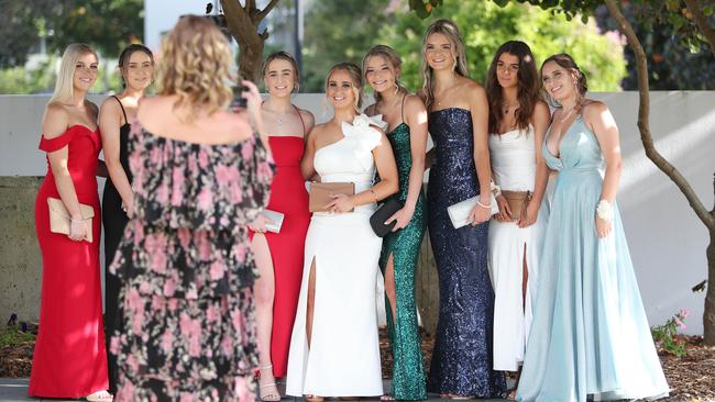 Say cheese. St Brigid’s students pose for a photographer at their formal.