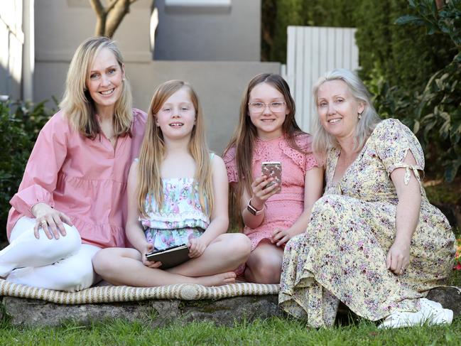 Jane Thompson (left) with her daughter Eloise Kench, and friend Sandi Ayliffe (right) and her daughter Lily Ayliffe, 10. Both parents reigned in their childrens’ tech use. Picture: Jonathan Ng