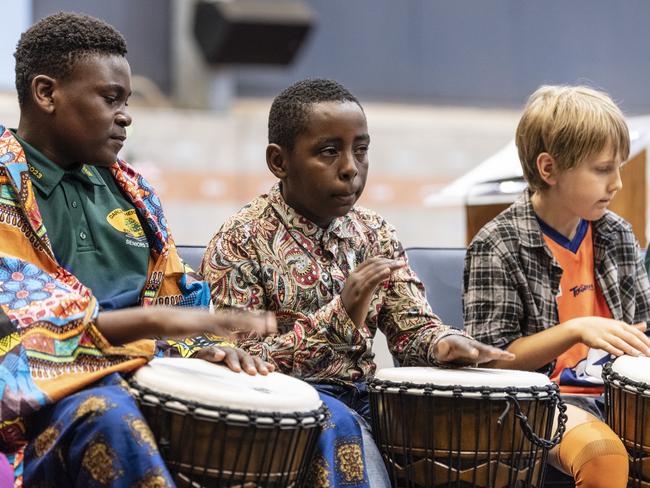 African drumming showcase participants (from left) Joshua Mukeba, Peter Faustine and Cooper Mayers during Harmony Day celebrations at Darling Heights State School. Picture: Kevin Farmer