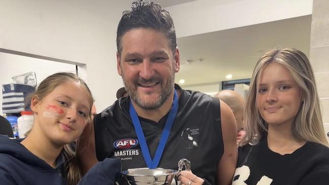 Brendan Fevola with his daughters Leni and Lulu after the victory.