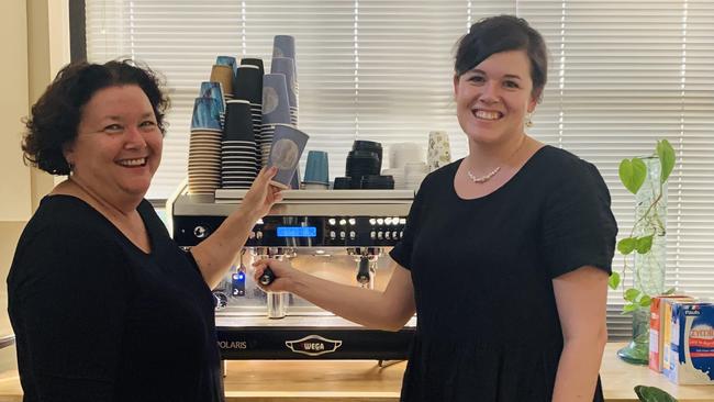 Julie and Meg Hopkins on the coffee machine