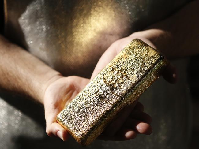 Gold images and samples of a Gold pour photographed at The Perth Mint in Perth, Wednesday, April. 24, 2013. (AAP Image/Theron Kirkman) NO ARCHIVING