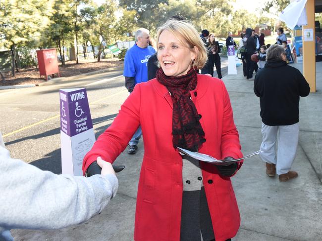 Labor candidate Peta Murphy greets voters at Elisabeth Murdoch College polling station in Lanwarrin. Picture: Jason Sammon