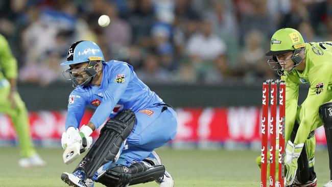 Rashid Khan of the Strikers hits a six during the Big Bash League (BBL) cricket match between the Adelaide Strikers and Sydney Thunder at Adelaide Oval in Adelaide, Tuesday, December 31, 2019. (AAP Image/Kelly Barnes)