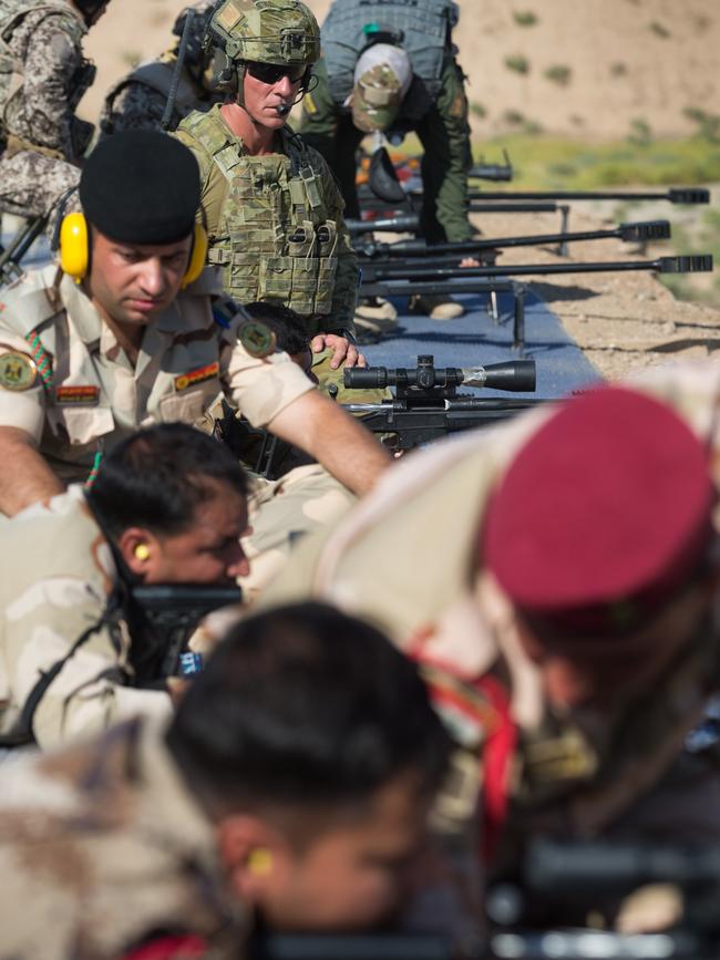 Australian Army soldier Sergeant Joshua Raward, observes as Iraqi Army soldiers fire during advanced marksmanship training at Taji Military Complex, Iraq. Picture: Defence Media