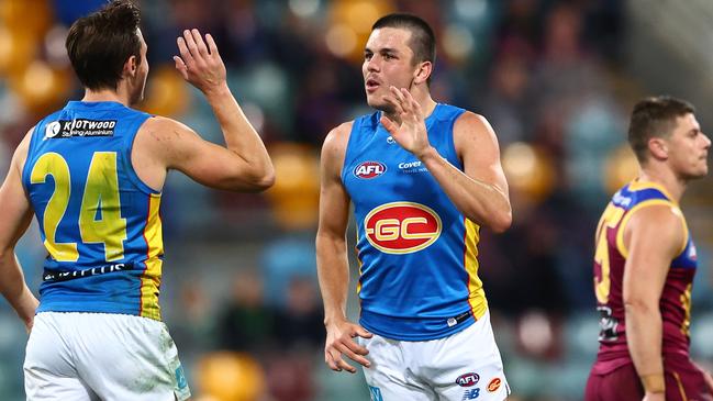 Elijah Hollands celebrates a goal with his first kick in the AFL. Picture: Chris Hyde/AFL Photos/Getty Images