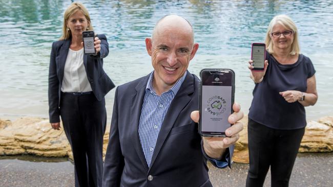 Federal MPs, Angie Bell, Stuart Robert and Karen Andrews hold up the COVIDSafe app. Picture: Jerad Williams