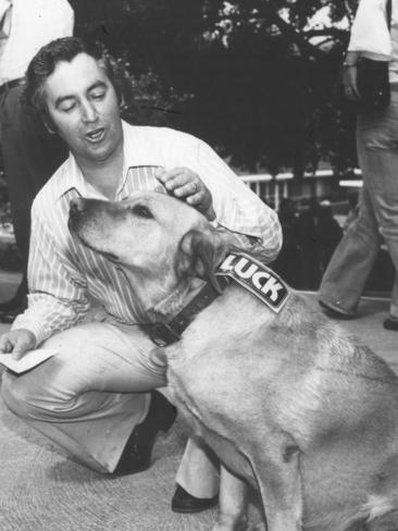 Bruce Goodluck with a canine campaign helper.