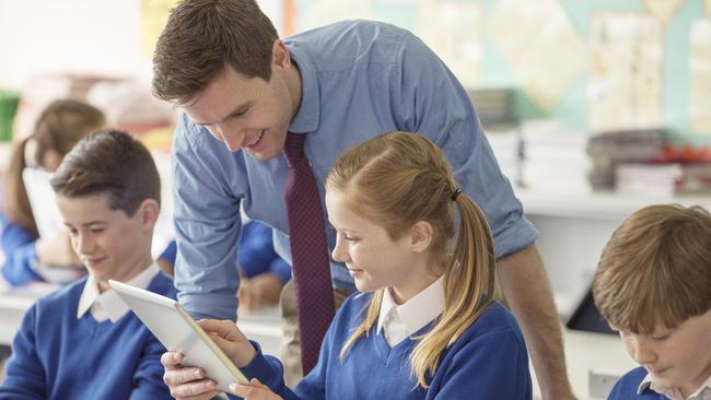 istock image lf teacher and pupils in classroom