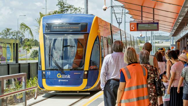 The crowds wait as the light rail tram enters the station at Helensvale. Picture: Jerad Williams