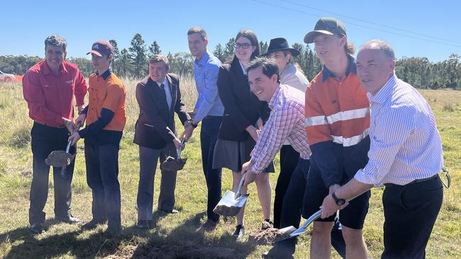 Premier Annastacia Palaszczuk (rear, in hat) with Maryborough MP Bruce Saunders, Transport Minister Mark Bailey, Hervey Bay MP Adrian Tantari and Fraser Coast Mayor George Seymour turn the sod at the site of the new $239 million Torbanlea train factory with the help of students from Maryborough State High School.