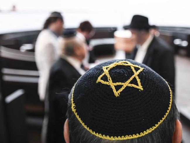 TOPSHOT - A guest wears a kippah with the Star of David during the inauguration of the Weill-Synagogue in in Dessau-Rosslau, eastern Germany on October 22, 2023. (Photo by Hendrik Schmidt / POOL / AFP)