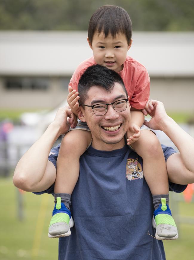 Elliot Tan gets a ride with dad Xiao Tan at the Toowoomba Royal Show, Saturday, April 1, 2023. Picture: Kevin Farmer