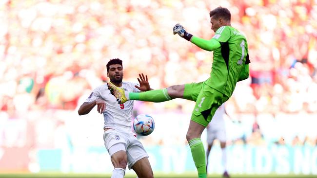 Wales keeper Wayne Hennessey fouls Iran's Mehdi Taremi. Picture: Hannah Mckay/Getty Images