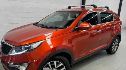 The vehicle involved is an orange KIA SUV, similar to the one pictured, with roof racks and a damaged driver's side mirror. Picture: SA Police