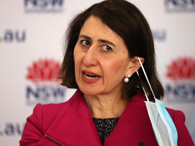 Gladys Berejiklian removes her mask before speaking during a Covid-19 update in Sydney. Picture: NCA NewsWire / Dylan Coker