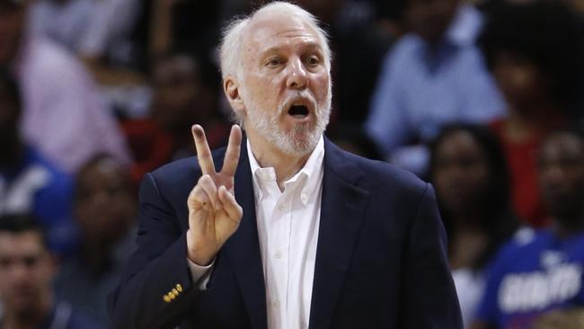 San Antonio Spurs head coach Gregg Popovich calls out a play during the second half of a preseason NBA basketball game against the Miami Heat.