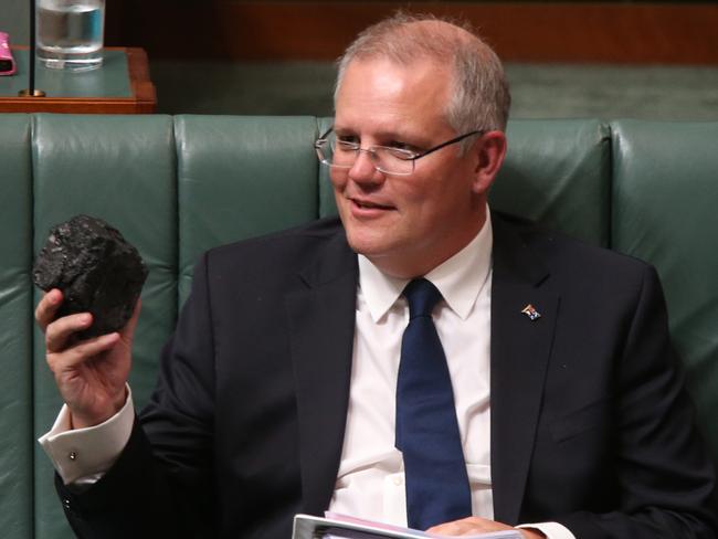 Treasurer Scott Morrison with coal during Question Time in the House of Representatives Chamber at Parliament House in Canberra. Pic by kym Smith