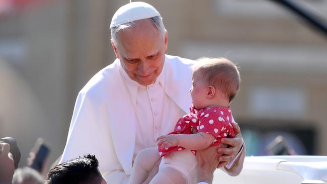 Pope Leo XIV blesses a baby before his inaugural mass. Picture: Getty Images