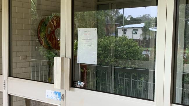 There are signs at a Nerang barber advising customers of reduced hours because of the ‘China virus”