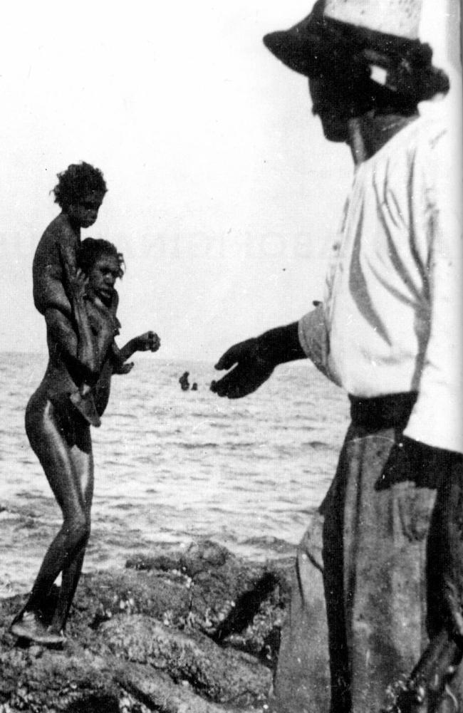 An Aboriginal woman backs away from a white man holding a gun on Bentinck Island, Queensland, in 1901. Picture from the book ‘North Of Capricorn — The Untold Story of Australia’s North’ by Henry Reynolds.