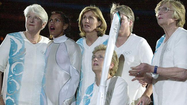 The six flame carriers (from left) Dawn Fraser, Cathy Freeman, Debbie Flintoff-King, Betty Cuthbert, Raylene Boyle (partly obscured) and Shirley Strickland at the Sydney 2000 Olympics. Picture: Jeff Darmanin