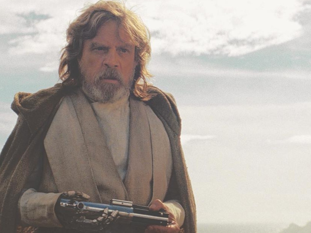 Mark Hamill as Luke Skywalker in Star Wars: The Last Jedi, showing his robotic hand. Picture: Lucasfilm Ltd