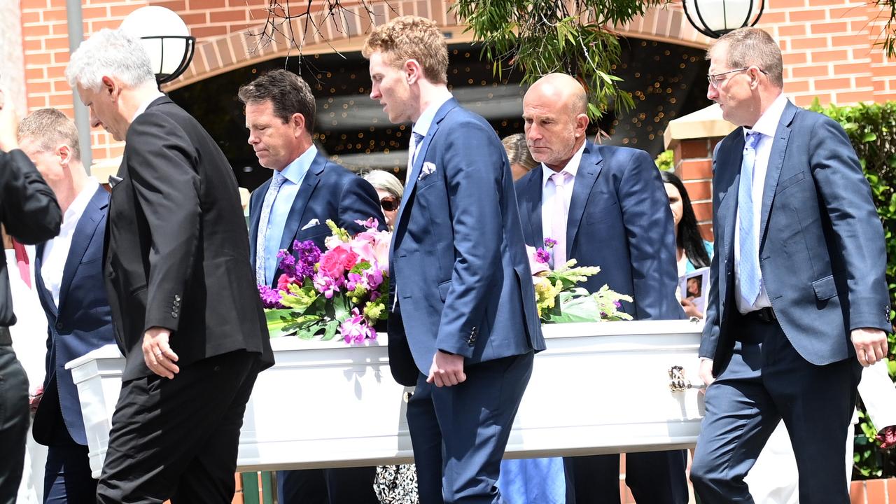 Father and son (centred) carry the coffin of Lilie James who was murdered. Picture: Jeremy Piper