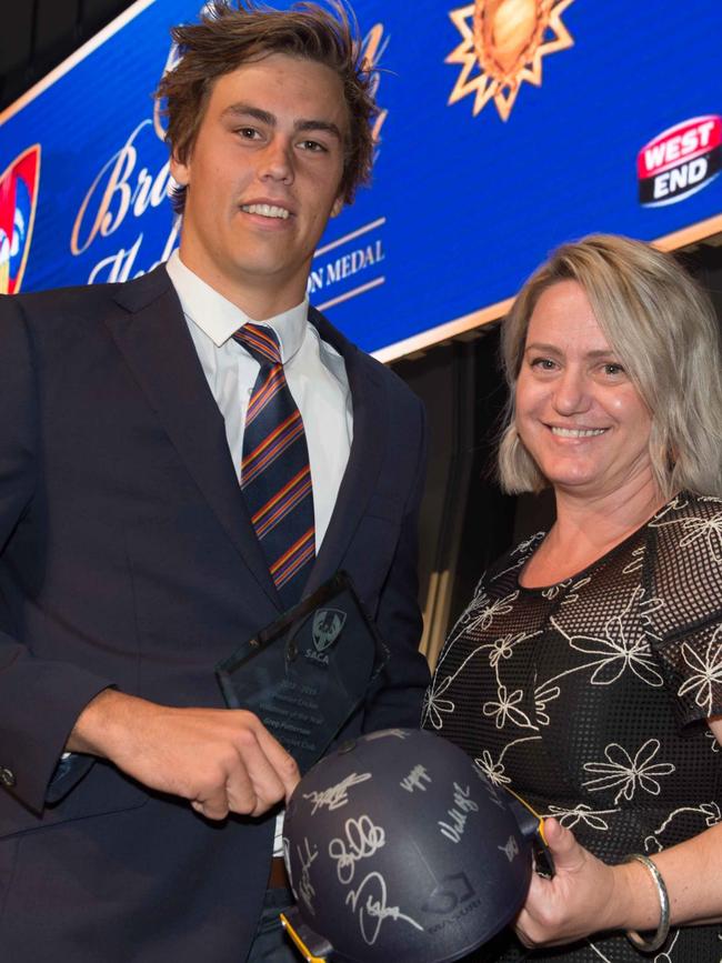 Adelaide cricketer Nick Patterson receiving the SACA Volunteer of the Year award on behalf of his late father, Greg, with Cricket Australia's Vanessa Walker. Picture: Simon Stanbury