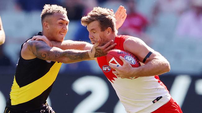 Luke Parker tries to fend off Tiger Shai Bolton. Sydney’s upset win in the Round 3 clash was the first sign the Richmond dynasty was under stress. Picture: Michael Klein