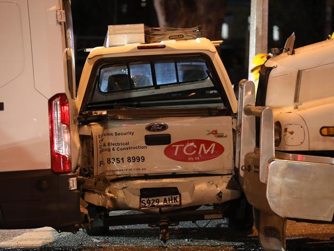 One of the cars is sandwiched between the truck and another vehicle after the crash on Wednesday night. Picture Dean Martin