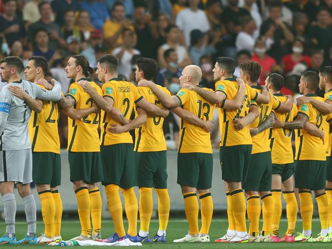 MELBOURNE, AUSTRALIA - JANUARY 27: Australia stand for their national anthem during the FIFA World Cup Qatar 2022 AFC Asian Qualifier match between Australia Socceroos and Vietnam at AAMI Park on January 27, 2022 in Melbourne, Australia. (Photo by Mike Owen/Getty Images)