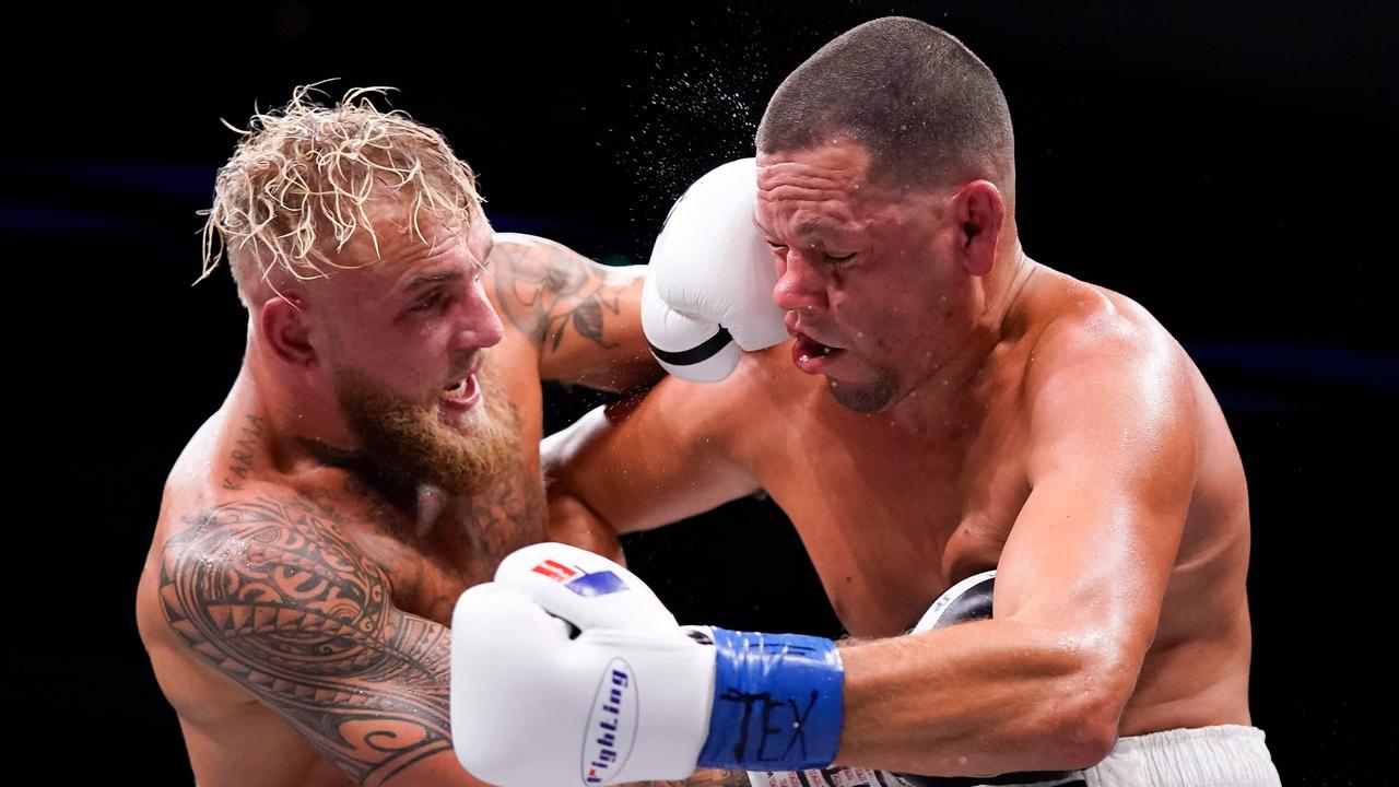 Jake Paul, left, and Nate Diaz trade punches during the third round of their fight at the American Airlines Center on August 05, 2023 in Dallas, Texas. Sam Hodde/Getty Images/AFP