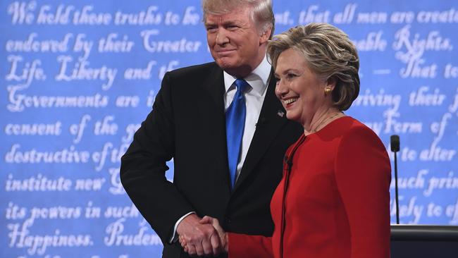 The candidates shake hands.