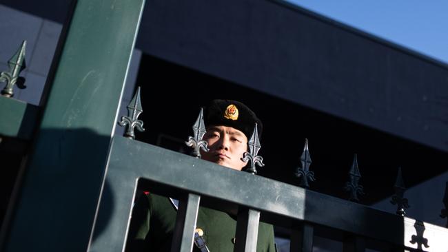 A Chinese paramilitary policeman stands guard at the Australian embassy in Beijing. Picture: AFP