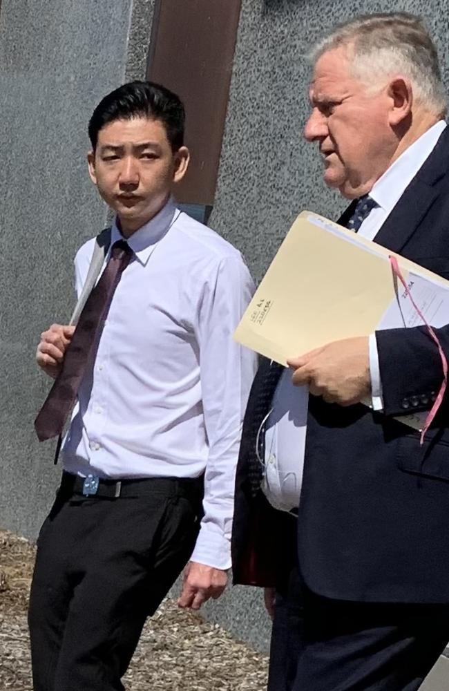 Bai Eng Lee (left) leaves Taree Local Court with his lawyer on December 14.