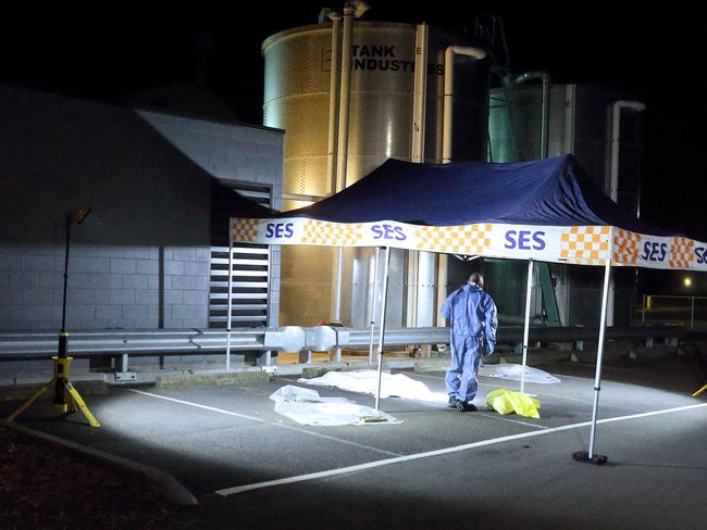 A forensic officer examines the scene. Photo: Patrick Herve