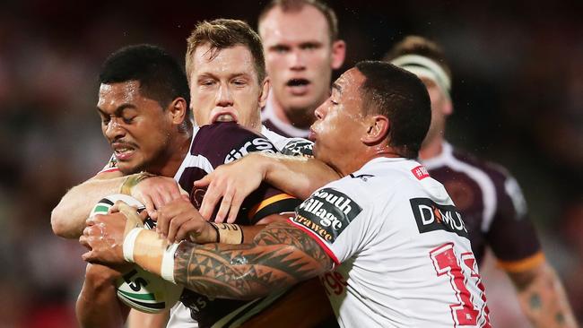 SYDNEY, AUSTRALIA — MARCH 08: Anthony Milford of the Broncos is tackled during the round one NRL match between the St George Illawarra Dragons and the Brisbane Broncos at UOW Jubilee Oval on March 8, 2018 in Sydney, Australia. (Photo by Matt King/Getty Images)