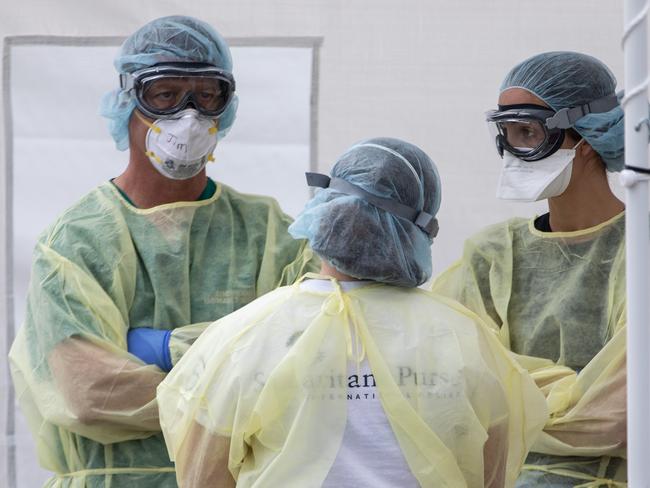 CREMONA, ITALY - MARCH 20: Medical personnel stand as they wait to receive the first patient affected by COVID-19 at a Samaritan's Purse Emergency Field Hospital on March 20, 2020 in Cremona, near Milan, Italy. Samaritans Purse is an evangelical Christian organization working in crisis areas of the world; thanks to a 68-bed respiratory unit, 32 members of Samaritan's Purse disaster response team will provide medical care during the novel coronavirus pandemic. (Photo by Emanuele Cremaschi/Getty Images)