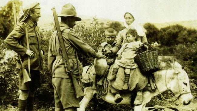 Meeting the locals ... ANZAC troops with a Turkish woman and children. Picture: Supplied